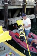 Lifting the fish back up onto the barge for a little R&R