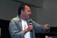 Paul Reiser work the crowd at the auction